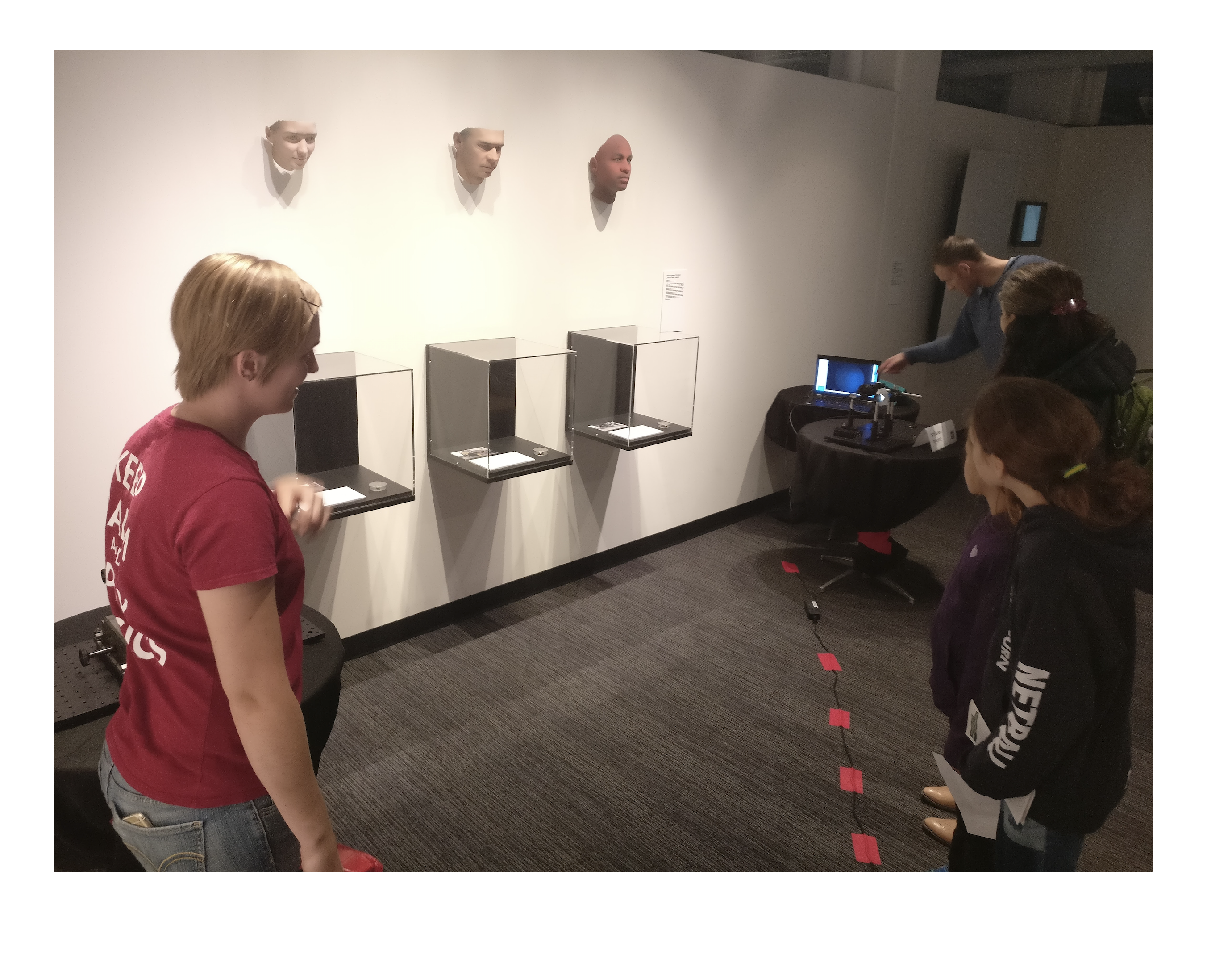 Applied Physics graduate student Emily presents Schlieren imaging to a family