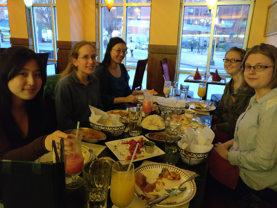 Physicists from MIT & Harvard discussing over delicious Indian food