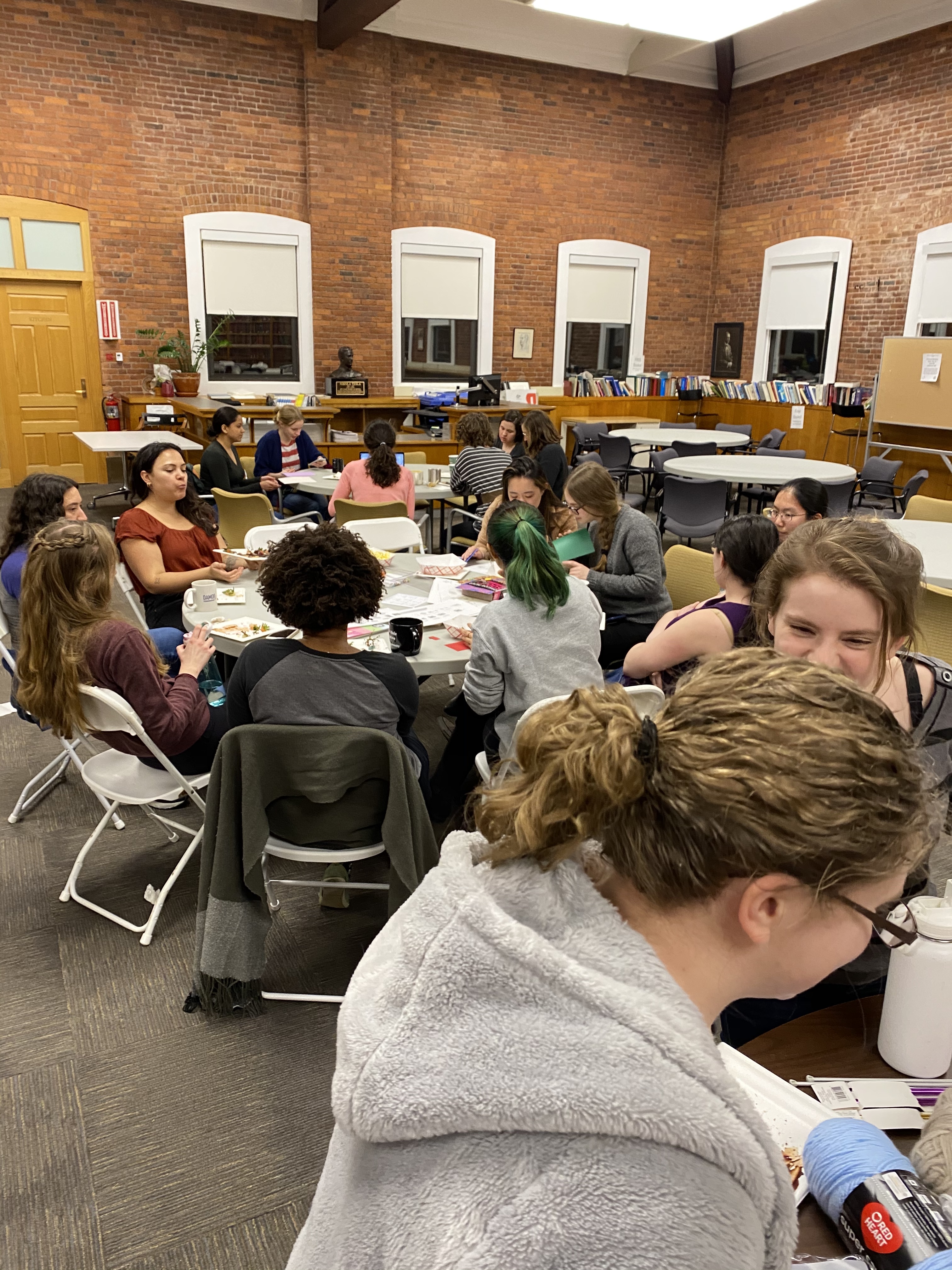 Women in Physics members enjoying snacks and doing crafts.