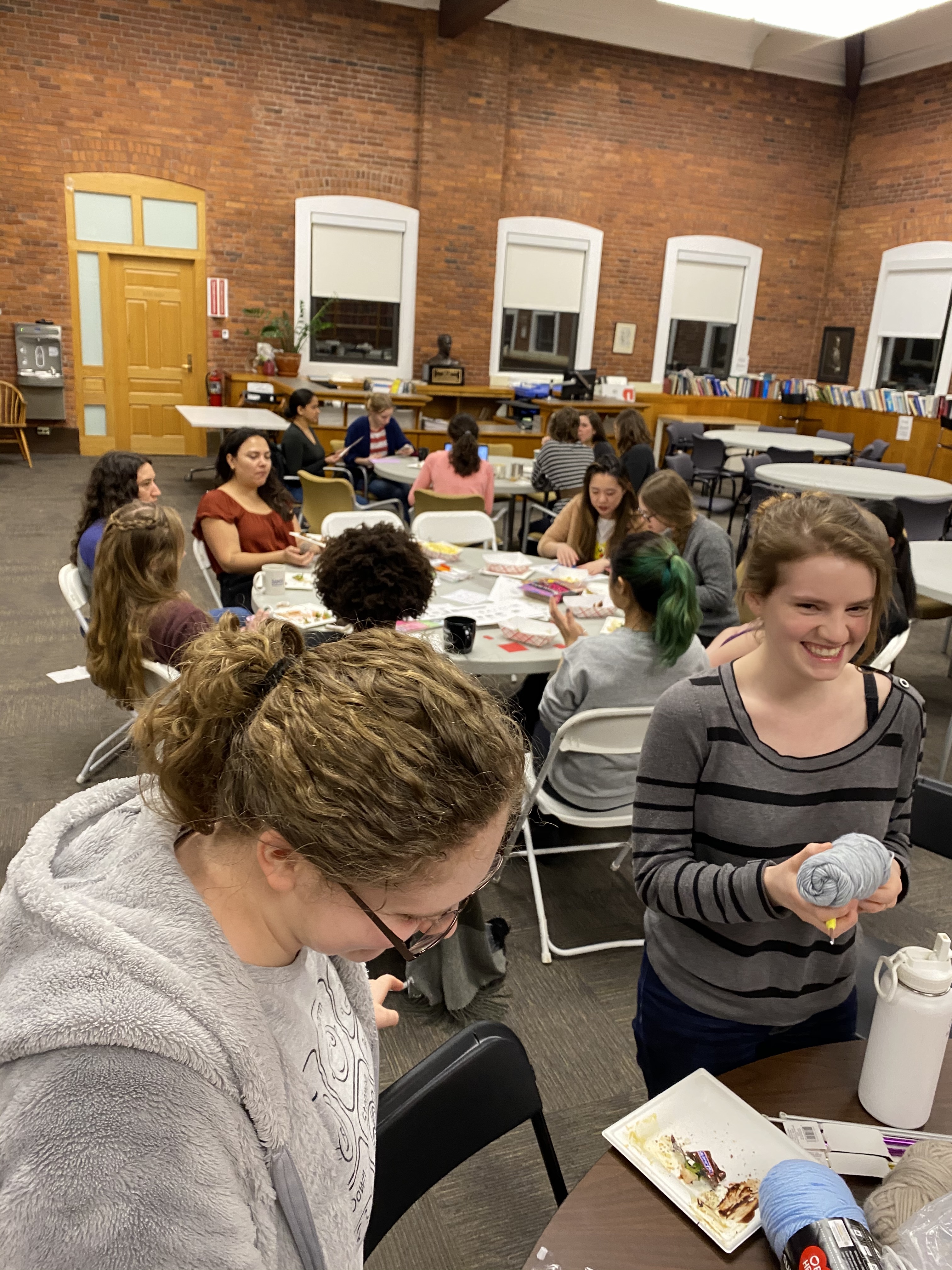 Women in Physics members enjoying snacks and doing crafts.
